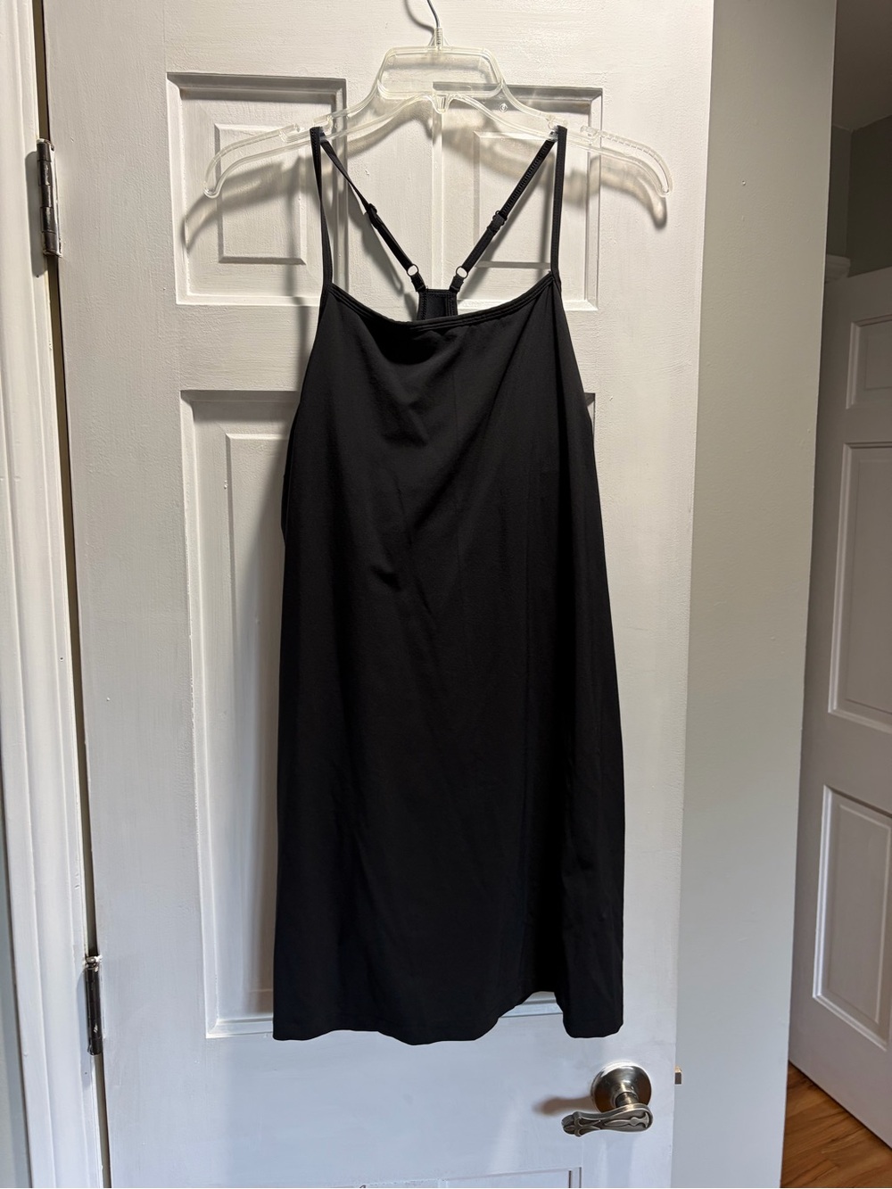 Women's Black Dri-fit dress with shorts underneath.